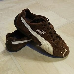 Brown puma shoes